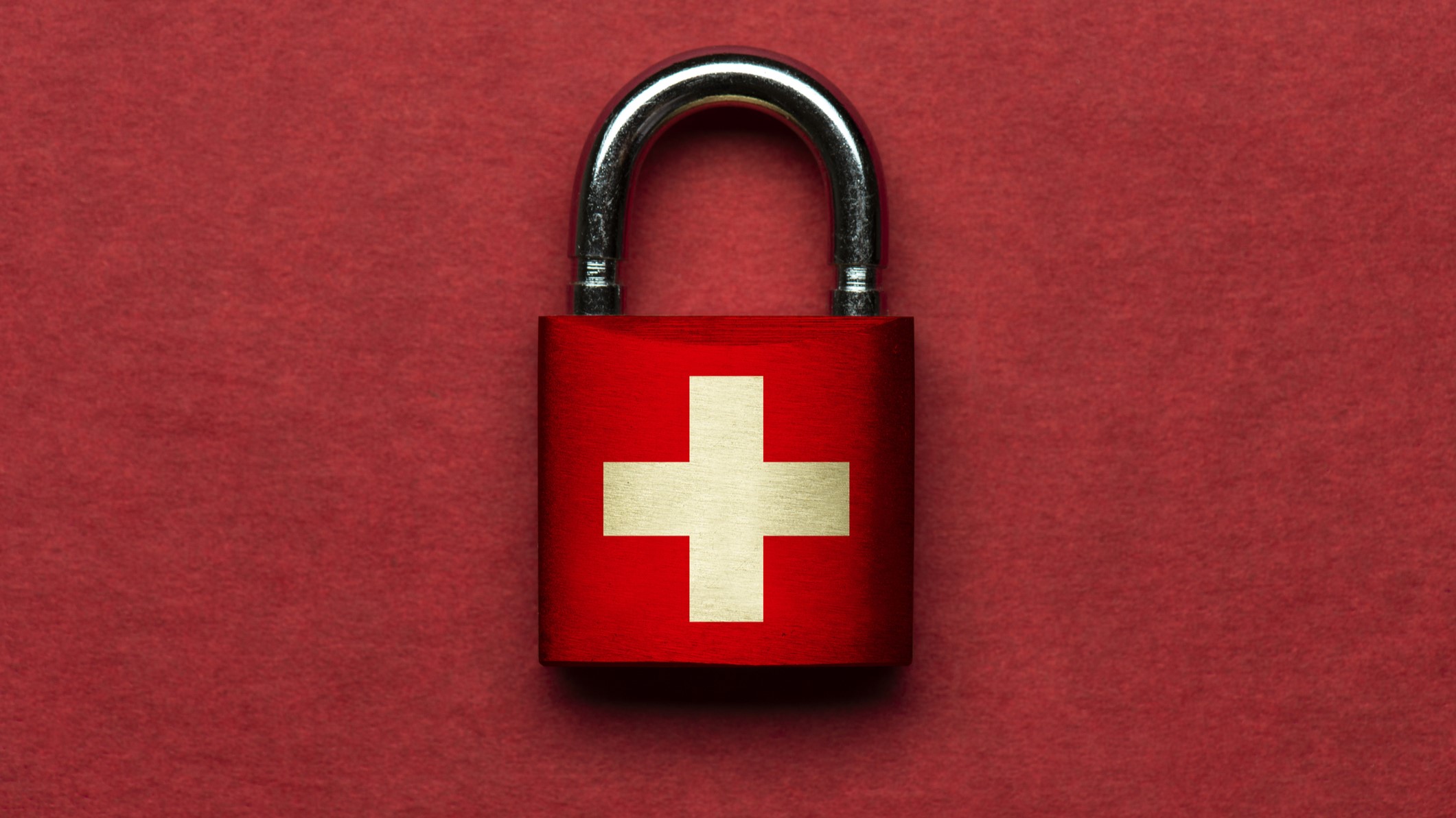 Padlock and Swiss Flag over a red background.