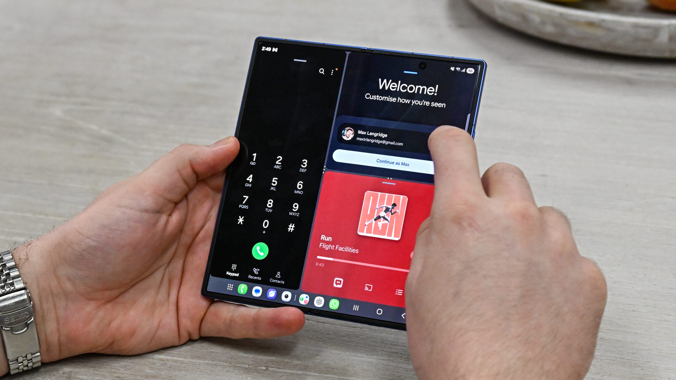 Someone using the Samsung Galaxy Z Fold 7 when unfolded, with three separate apps open at once.
