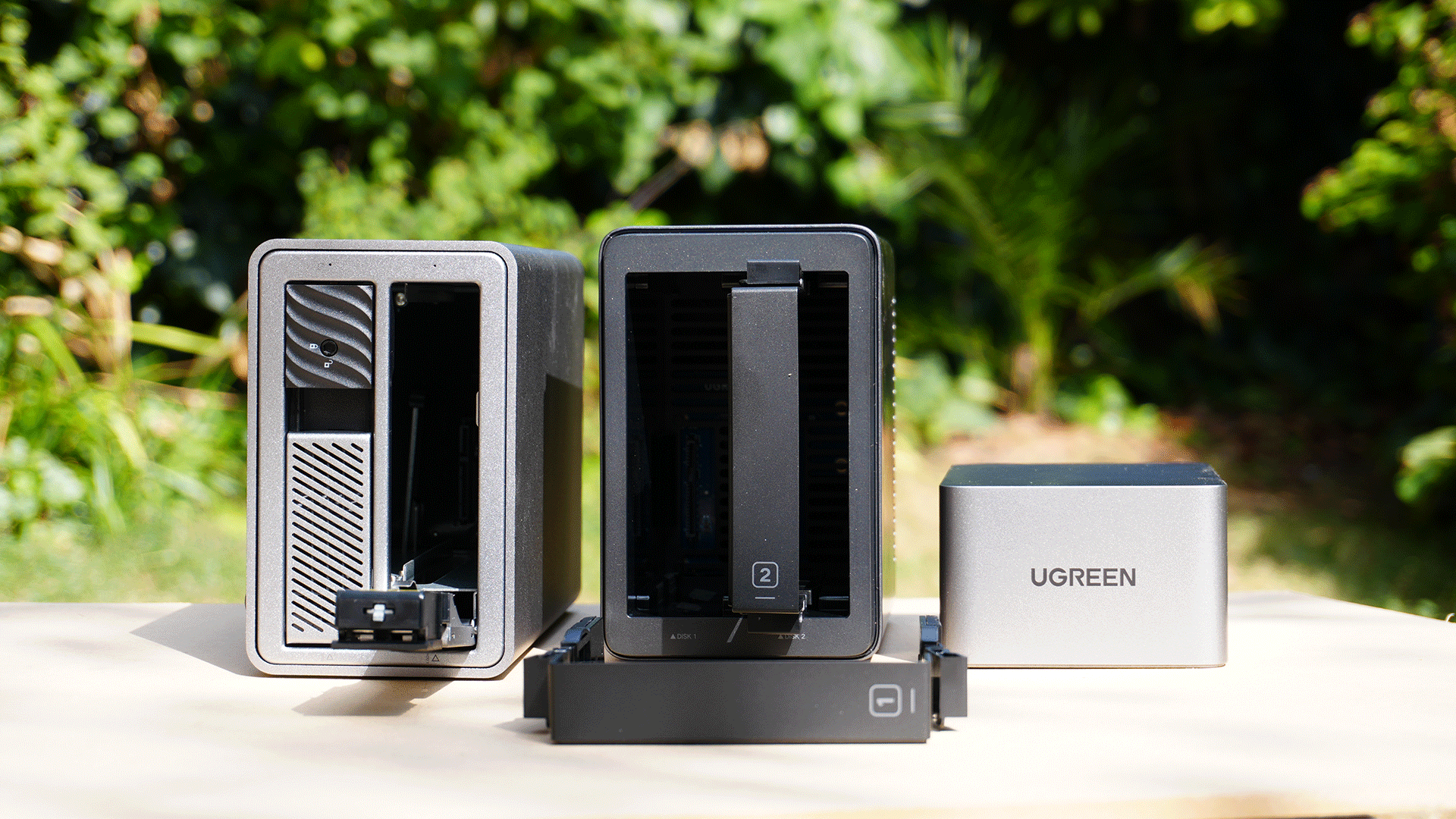 A NAS and a DAS side by side against a garden backdrop