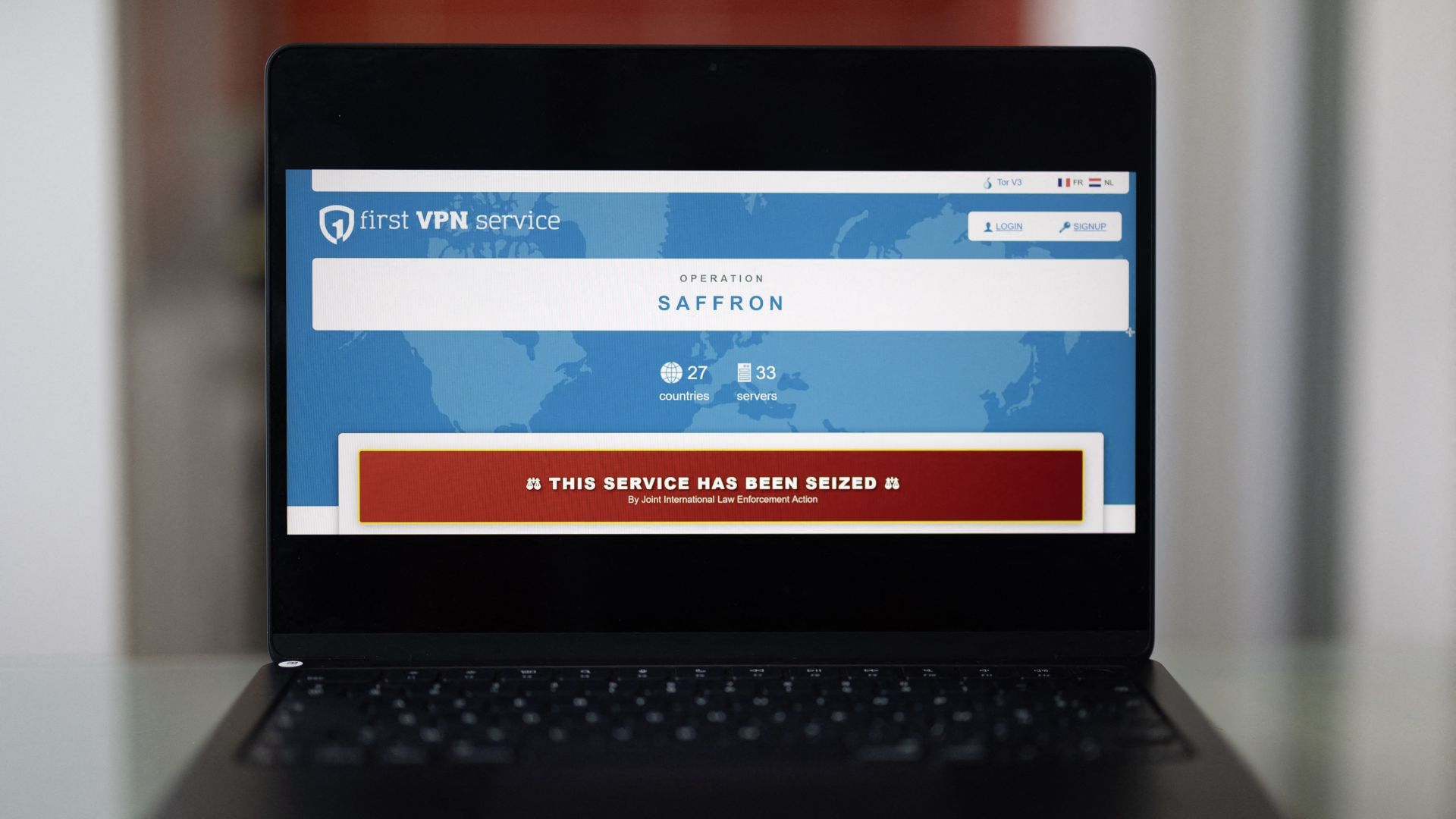 This photograph shows a laptop screen displaying the website of Europol featuring the First VPN service website with a message reading, 