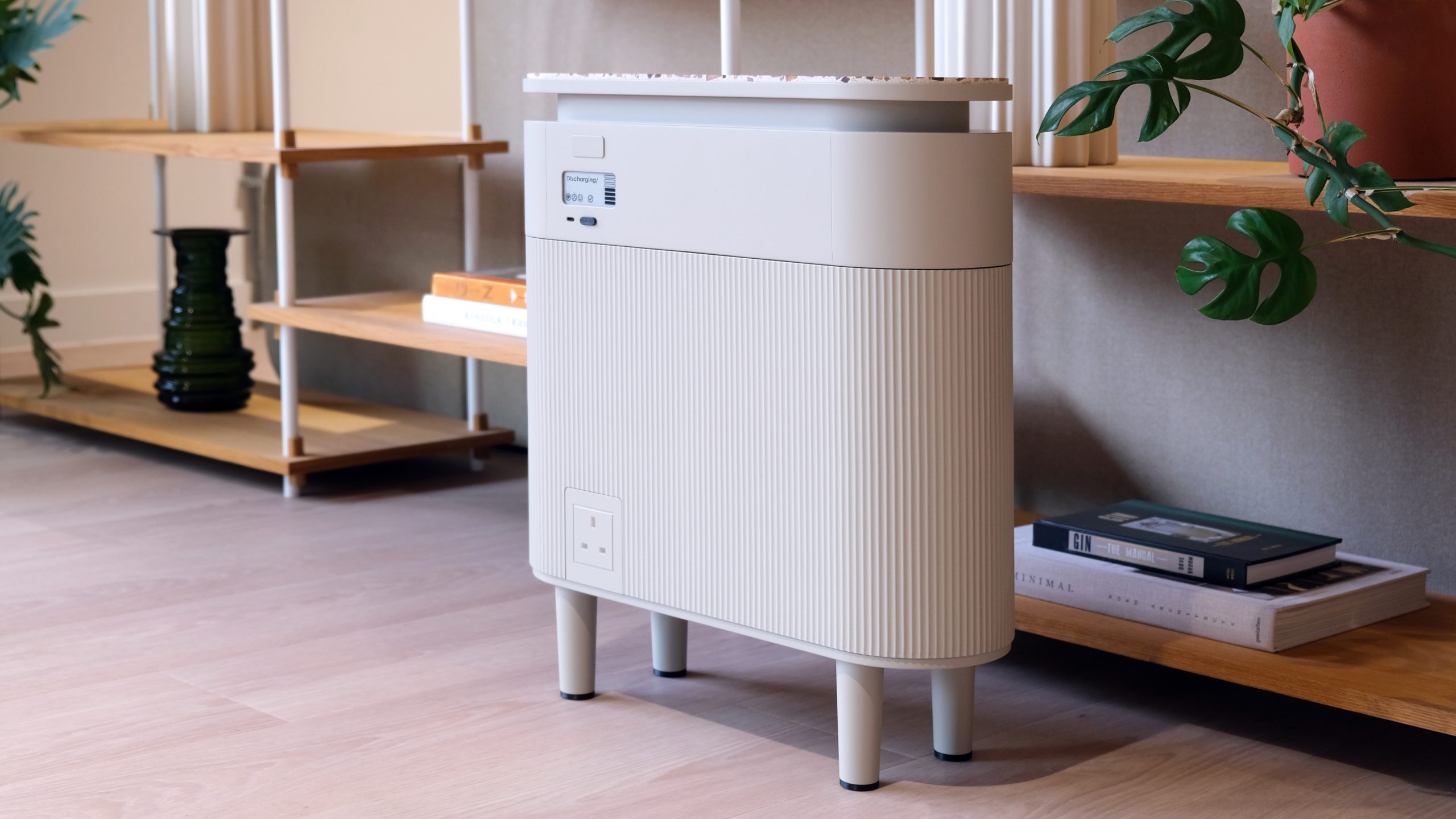 A Windfall Energy battery in front of some shelves